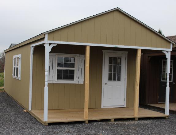 14x32 Peak White Deer Cabin with Buckskin walls, White trim, and shutters, and Barkwood shingles